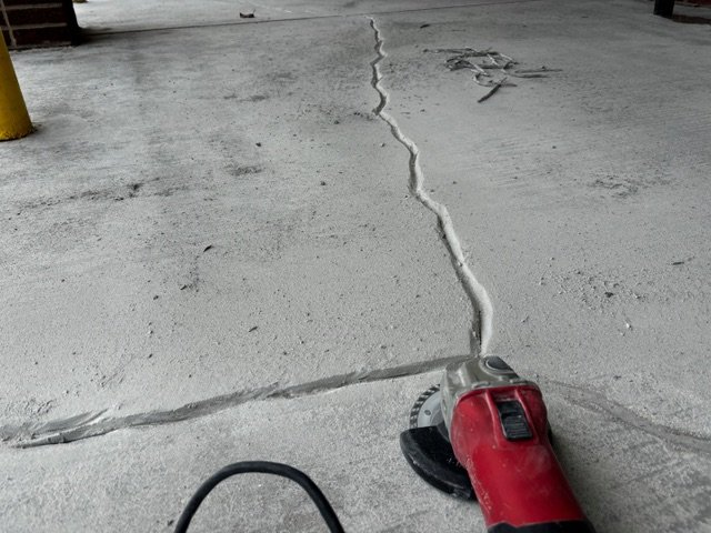 Crack repair and concrete maintenance on a commercial floor