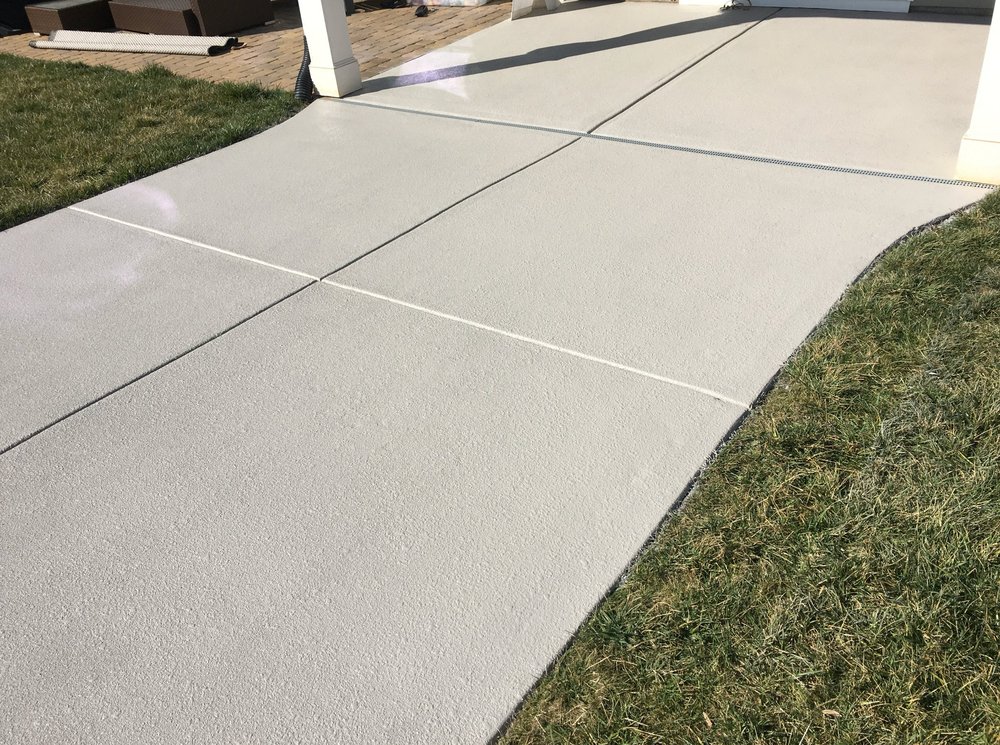 Decorative coated concrete patio with a smooth textured finish