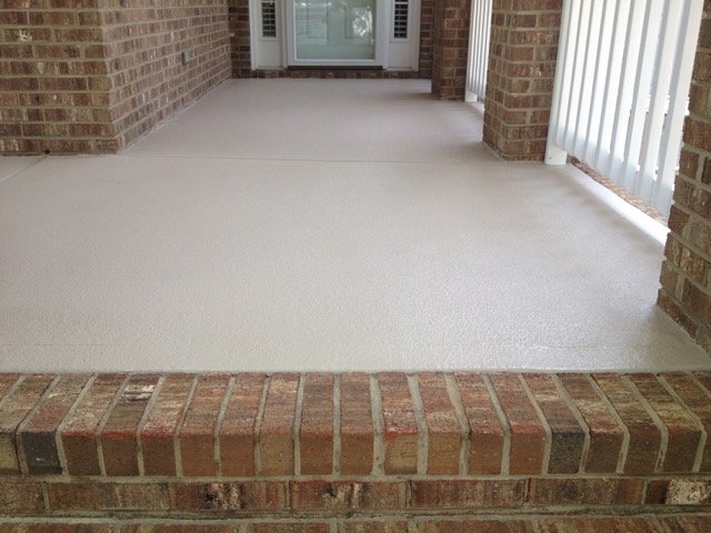 Freshly coated and sealed concrete porch
